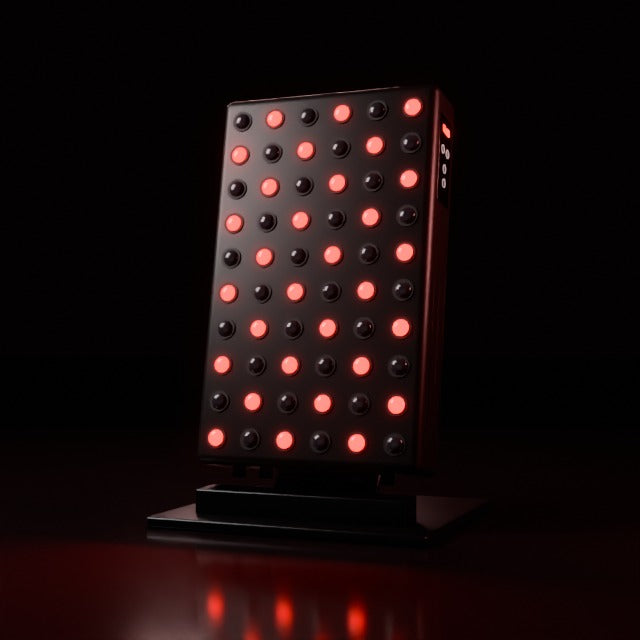 3D render of the AWA FX500 red light therapy panel powering on, with its side control panel and foldable stand