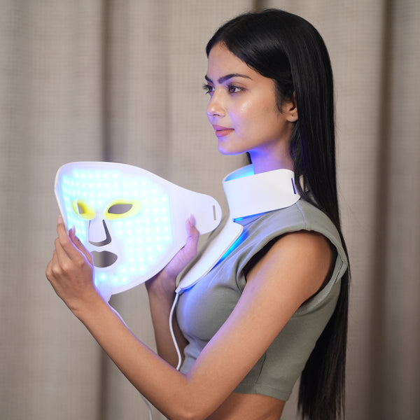 Woman holding the lit AWA LX300 face mask and neck piece